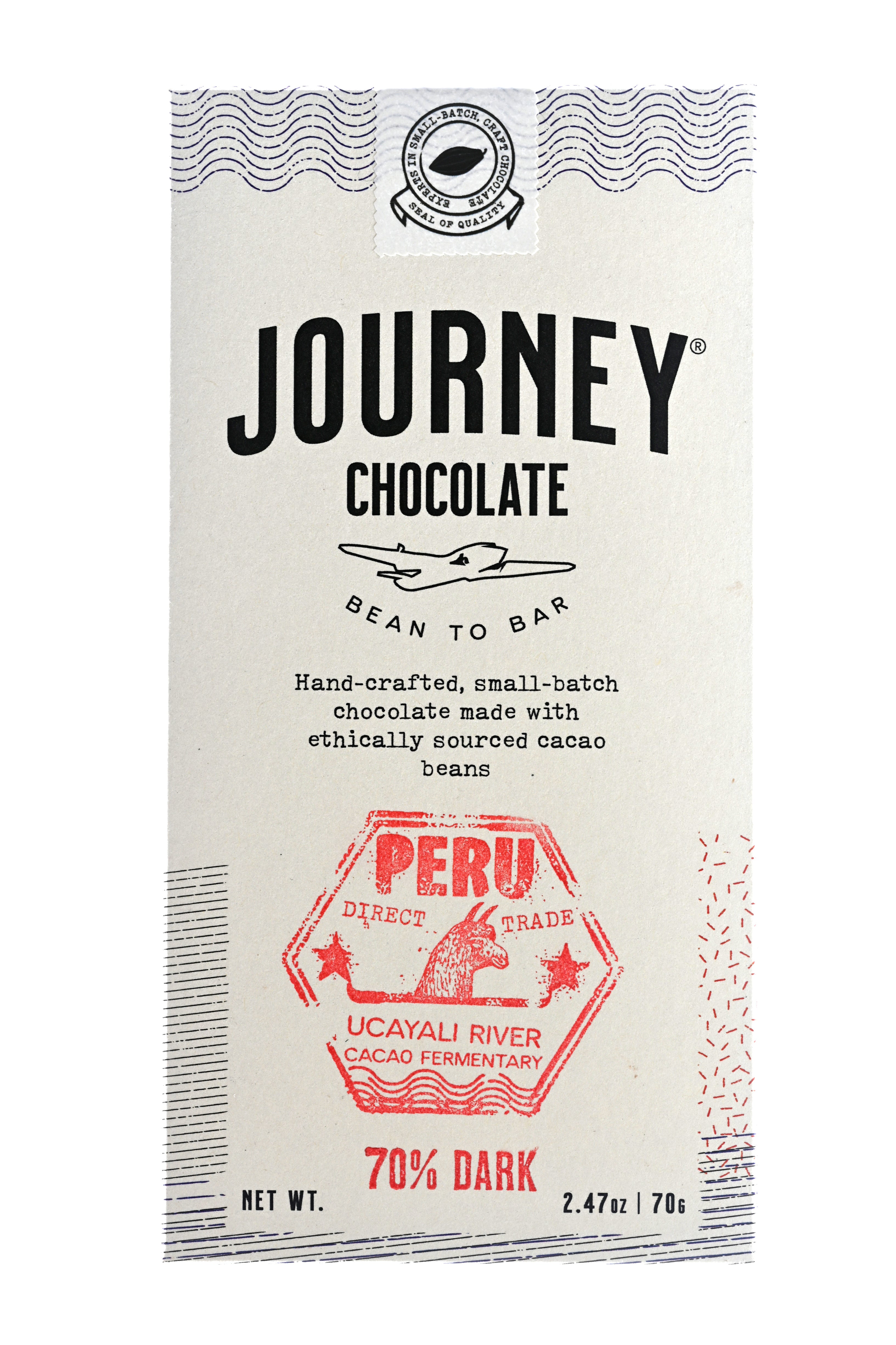 A large size packaged Journey Chocolate bar in an off-white cardboard box with wavy US postal service lines across the top, lower sides and bottom of the box. A white postage stamp style seal with a cacao pod in the middle seals the box, with the words "Experts in small-batch, craft chocolate" in a circle around the image and the words "Seal of Quality" at the bottom. The Journey Chocolate logo is centered on the bar and an Peru 70% dark stamp centered on the bottom, net weight 2.47 oz or 70 grams